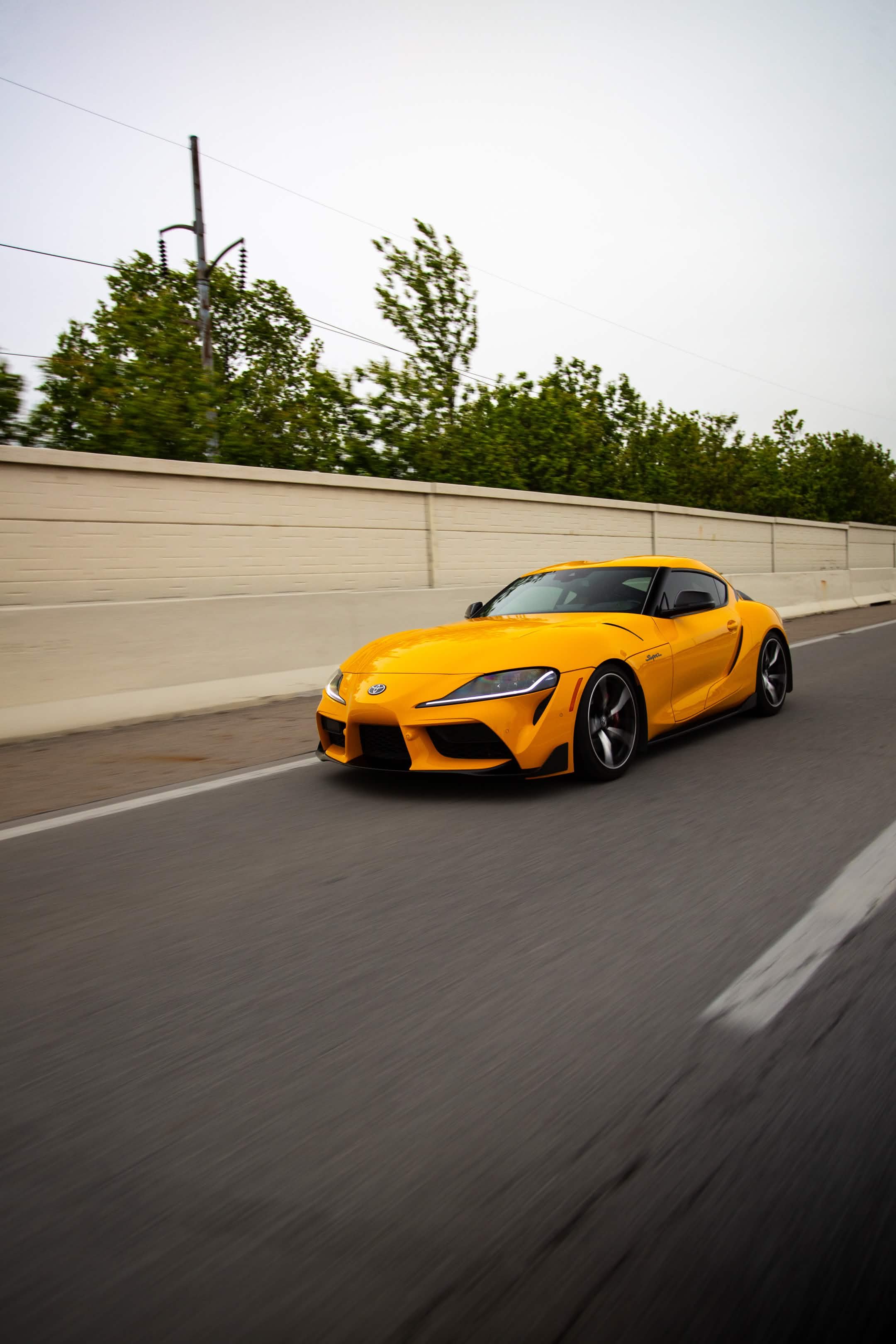 Orange Toyota GR Supra rolling shot Indiana Welchiani Media