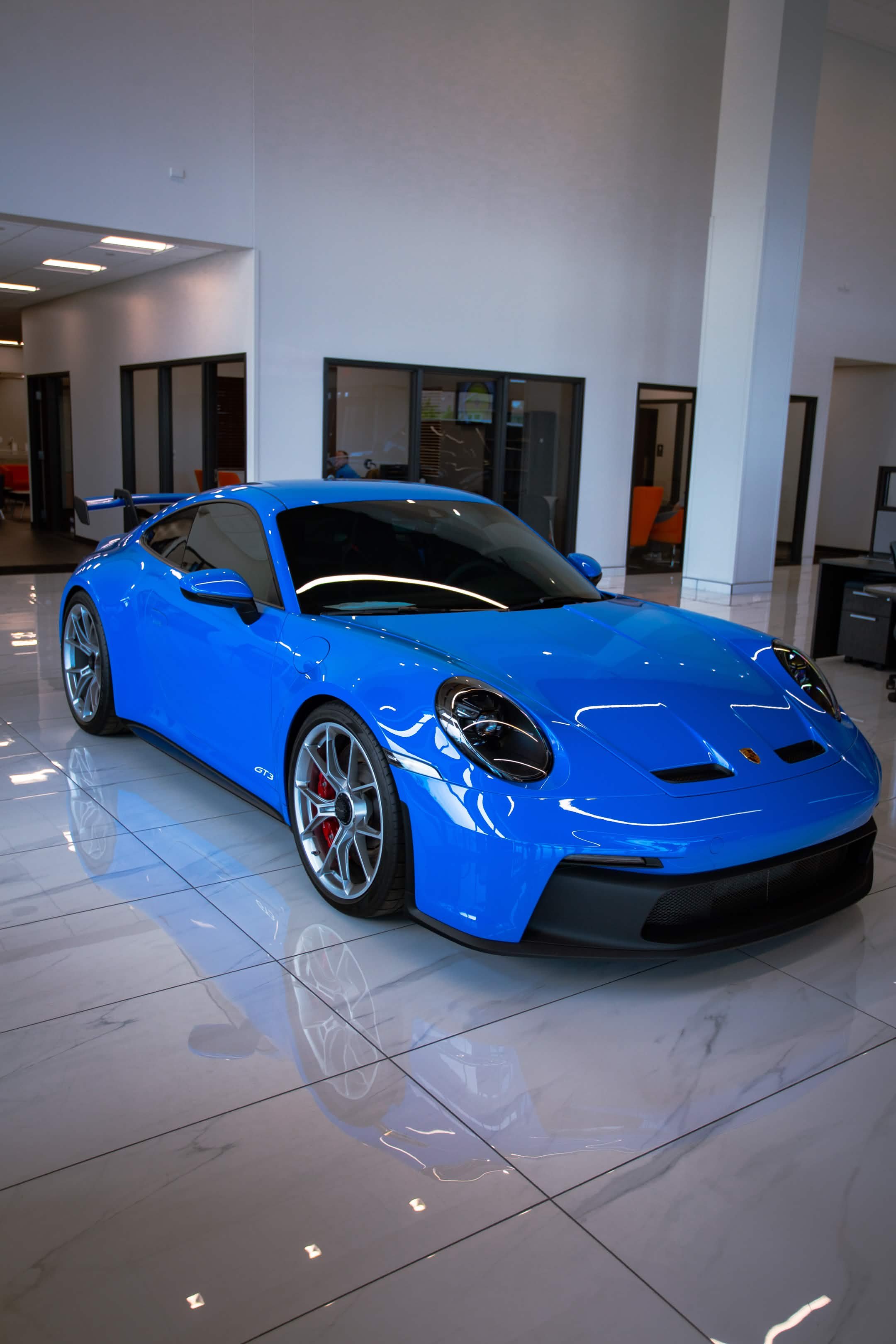 Porsche 911 GT3 blue showroom Indianapolis Welchiani Media